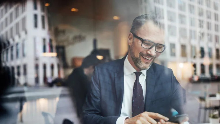 Business professional using a tablet at a table